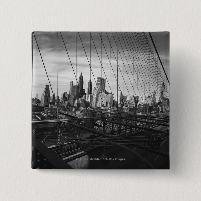 Cityscape through bridge cables 15 cm square badge (Front)