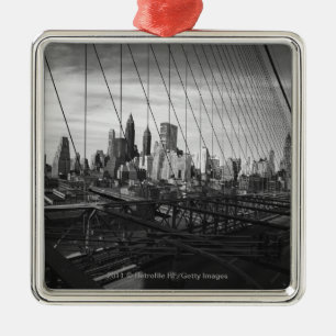 Cityscape through bridge cables metal tree decoration