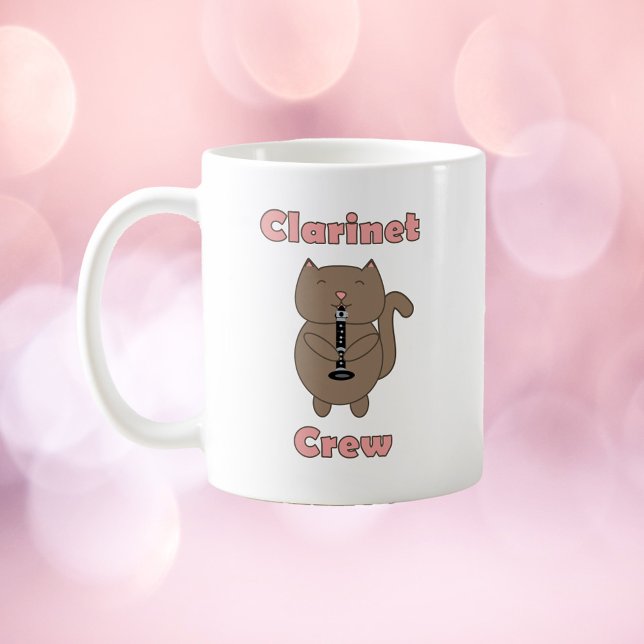 Clarinet Crew Cat Brown Pink Coffee Mug (A mug with a brown cat playing the clarinet and the words clarinet crew in pink.)