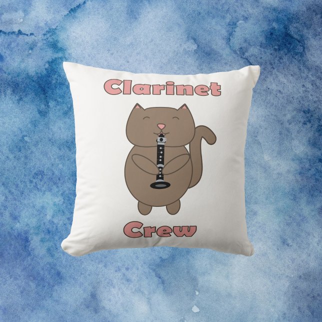 Clarinet Crew Pink Brown Cat Funny Cushion (A throw pillow with a brown cartoon cat playing the clarinet with the words clarinet crew in pink.)