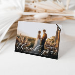 Classic Calligraphy Script Wedding Photo Folded Thank You Card<br><div class="desc">Elegant wedding thank you cards feature a single horizontal or landscape orientated wedding photo with "Thank You" overlaid at the bottom in chic white calligraphy script. Personalise with your names and wedding date in classic block lettering. Add a personal message and signature to the inside, along with an additional photo....</div>