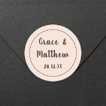 Classic Elegant Blush Pink Wedding Minimalist Round Sticker<br><div class="desc">Introducing our "Classic Elegant Blush Pink Wedding Minimalist Classic Round Sticker." Perfect for adding a touch of romantic sophistication to your wedding stationery, favours, or decorations, this sticker features a timeless blush pink design with minimalist elegance. Personalise it with your names and wedding date for a bespoke touch. Ideal for...</div>