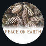 Classic Holiday Pine Cone Peace On Earth Classic Round Sticker<br><div class="desc">Festive,  earthy pine cones set off this classic,  elegant design wishing Peace On Earth.</div>