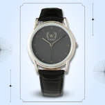 Classic Laurel Wreath Black Gold Monogram Watch<br><div class="desc">A classic laurel wreath design in black and gold,  giving a perfect mix of charm and elegance.
The monogram adds a special touch.
Ideal as a personalised gift for family and friends</div>