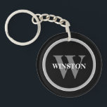 Classic Monogram: Personalised Black, White, and G Key Ring<br><div class="desc">Introducing our "Classic Monogram" Keychain – a perfect blend of elegance and functionality. This sophisticated accessory is designed for those who appreciate a classic style with a personal touch. Its elegant black, white, and grey colour scheme exudes a timeless sophistication that complements any set of keys. Personalise this keychain with...</div>