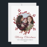 Classic Watercolor Berry Wreath Photo Christmas Holiday Card<br><div class="desc">holiday card features an elegant botanical design with a vibrant red berry wreath that artistically frames a family photo on a clean white background. The blend of modern cursive typography and a minimalist layout creates a warm yet professional feel,  perfect for celebrating memorable Christmas moments.</div>