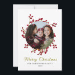 Classic Watercolor Berry Wreath Photo Christmas Holiday Card<br><div class="desc">holiday card features an elegant botanical design with a vibrant red berry wreath that artistically frames a family photo on a clean white background. The blend of modern cursive typography and a minimalist layout creates a warm yet professional feel,  perfect for celebrating memorable Christmas moments.</div>