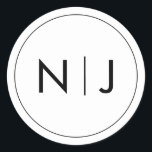 Classy Black Initials Monogram Wedding Classic Round Sticker<br><div class="desc">The monogram design merges the initials in a bold,  contemporary symbol,  striking in its simplicity. It’s a modern twist on tradition,  a visual emblem of two lives becoming one. Perfect for adding a personalised touch to their wedding day details.</div>