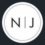 Classy Black Initials Monogram Wedding Classic Round Sticker<br><div class="desc">The monogram design merges the initials in a bold,  contemporary symbol,  striking in its simplicity. It’s a modern twist on tradition,  a visual emblem of two lives becoming one. Perfect for adding a personalised touch to their wedding day details.</div>