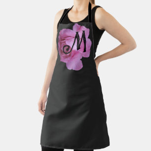 Classy pink rose monogram on black by Berglind  Apron