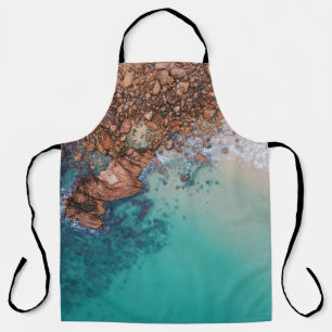Clear blue sea and rocks apron