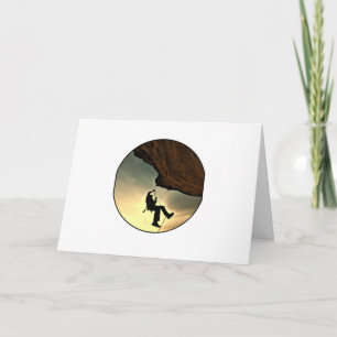 Climbing mountain man at sunset card