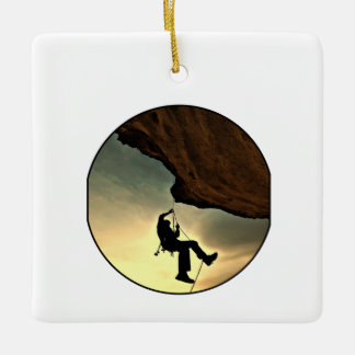 Climbing mountain man at sunset ceramic ornament