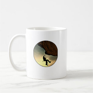 Climbing mountain man at sunset coffee mug