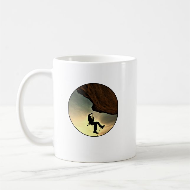 Climbing mountain man at sunset coffee mug (Left)