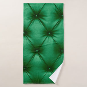 Close up background texture of dark green capitone bath towel