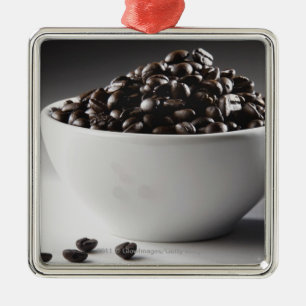 Close-up of a bowl full of coffee beans metal tree decoration
