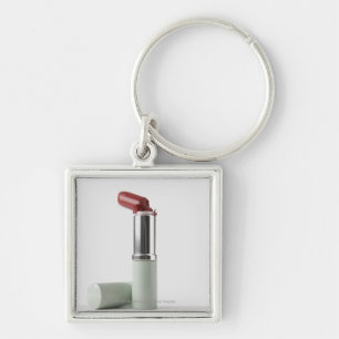 Close-up of a broken lipstick key ring