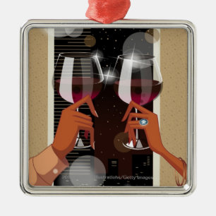 Close-up of a couple's toasting with wine glasses metal tree decoration