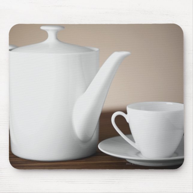 Close-up of a cup and a saucer with a tea kettle mouse pad (Front)