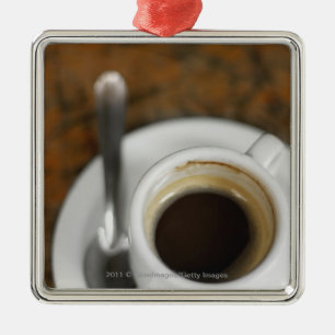 Close-up of a cup of coffee 2 metal tree decoration