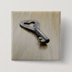 Close-up of a key 15 cm square badge