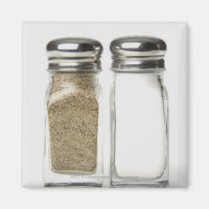 Close-up of a salt and a pepper shaker magnet