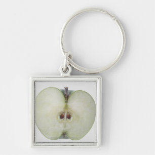 Close-up of a sliced granny smith apple key ring