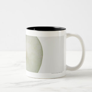 Close-up of a sliced granny smith apple Two-Tone coffee mug