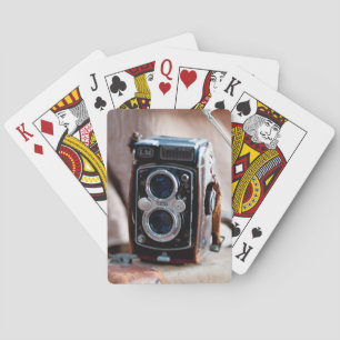 Close-up of an antique camera playing cards