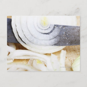 close-up of an onion, being cut into slices postcard
