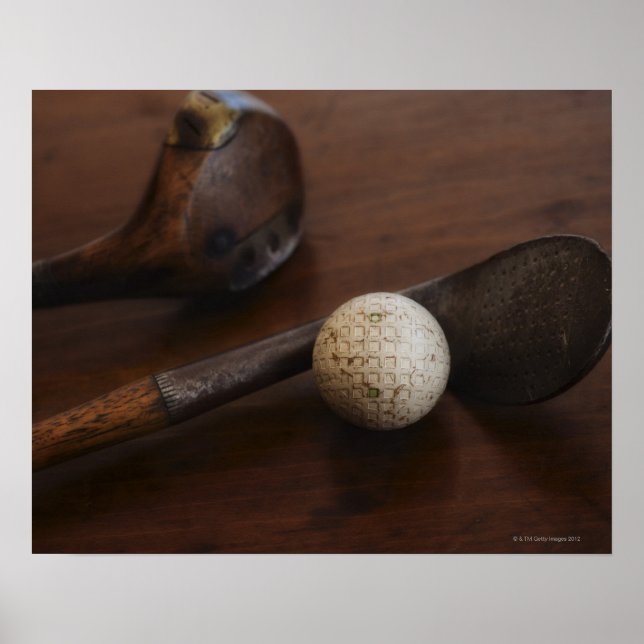 Close up of antique golf clubs and golf ball poster (Front)