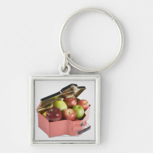 Close-up of apples in a box key ring