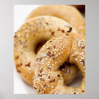 Close-up of assorted bagels on a plate poster