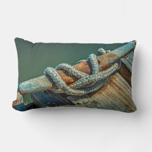 Close-up of boat cleat and rope lumbar cushion
