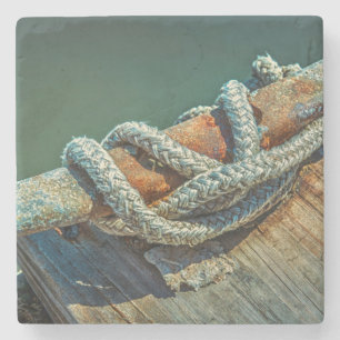 Close-up of boat cleat and rope stone coaster