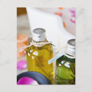 Close up of bottles with massage oils postcard