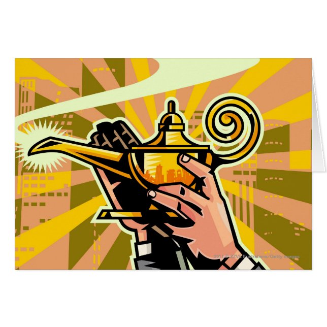 Close-up of businessman holding magic lamp (Front Horizontal)