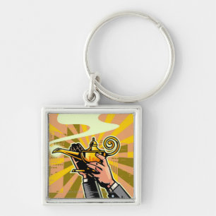 Close-up of businessman holding magic lamp key ring
