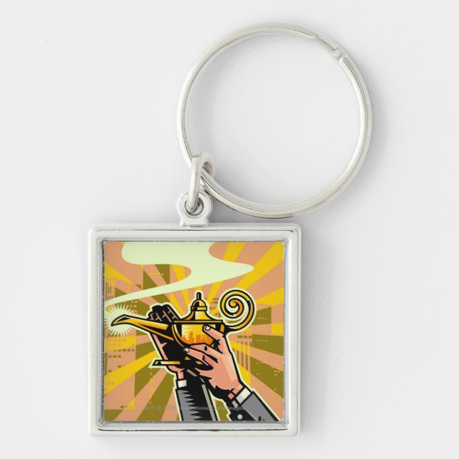 Close-up of businessman holding magic lamp key ring (Front)