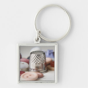 Close-up of buttons with a metal cap key ring