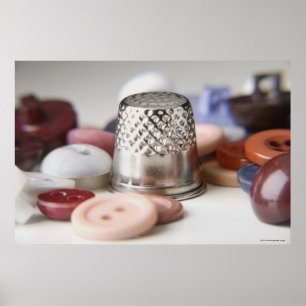 Close-up of buttons with a metal cap poster