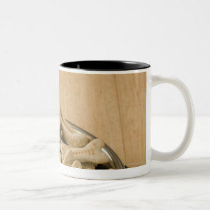 Close-up of dog biscuits in a dog bowl Two-Tone coffee mug
