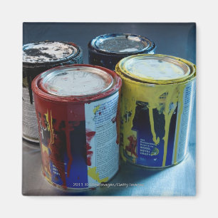 Close-up of four paint cans magnet