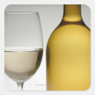 Close up of glass of white wine and wine bottle square sticker