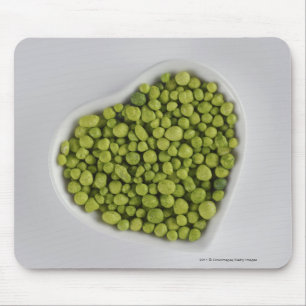 Close-up of green pebbles in a heart shape bowl mouse pad