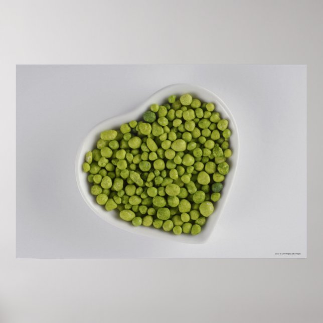 Close-up of green pebbles in a heart shape bowl poster (Front)