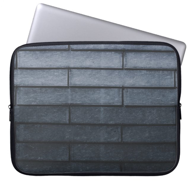 Close-up of grey brick wall laptop sleeve (Front)