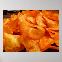 Close up of juicy, crispy, chips on black plate.