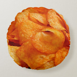 Close up of juicy, crispy, chips on black plate. round cushion